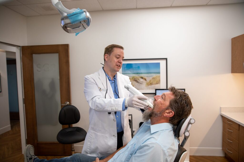 Dr. Niels Oestervemb taking a digital impression of a patient with an intraoral scanner