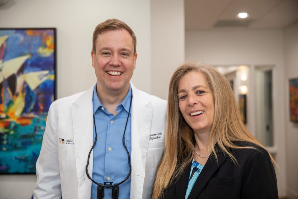 Dr. Niels Oestervemb with a smiling full-mouth rehabilitation patient