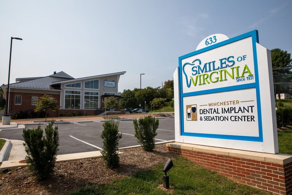 Street-side monument sign and office building of Winchester Dental Implant & Sedation Center in Winchester, VA