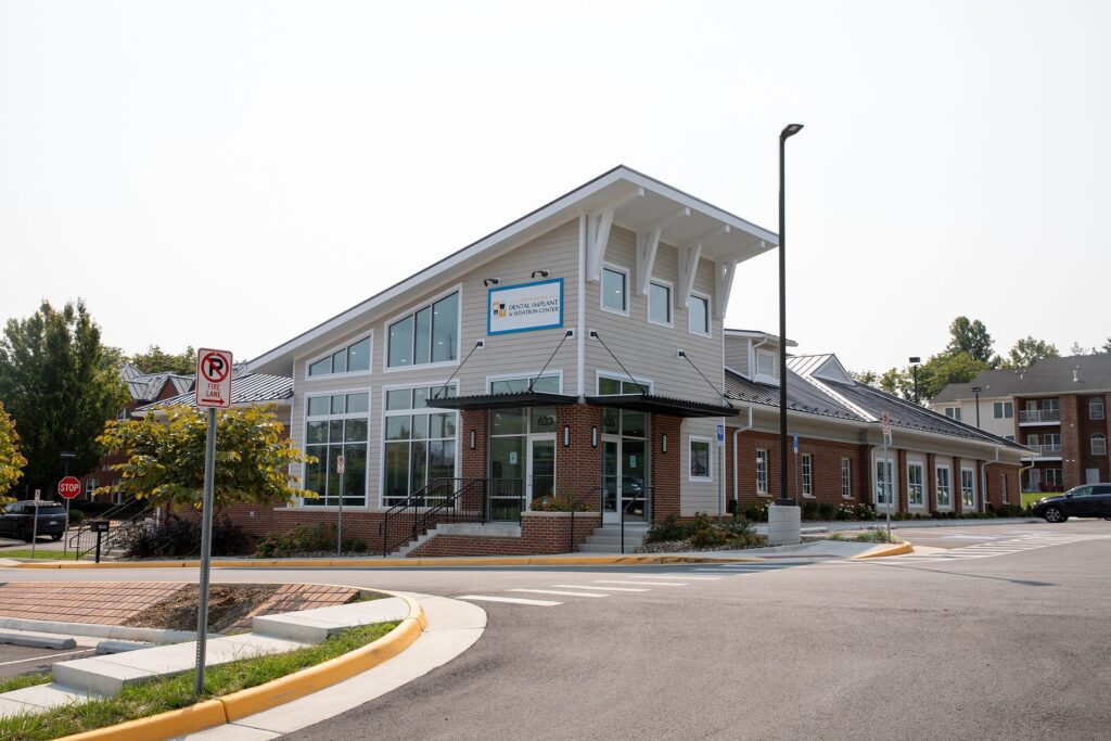 Exterior view of Winchester Dental Implant & Sedation Center from the parking lot in Winchester, VA